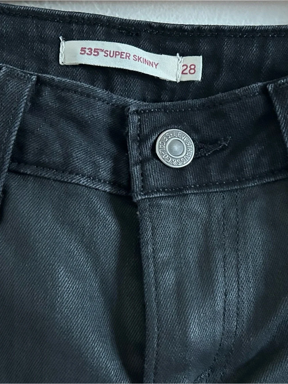 Levi’s Super Skinny size 28 black jeans with faux leather front panels